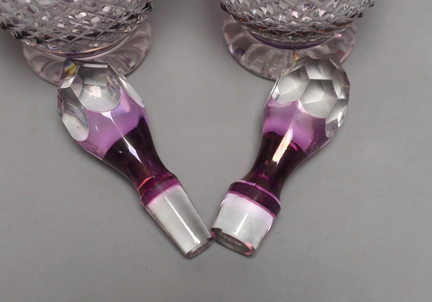 A pair of Bohemian silver mounted cut and amethyst flashed glass decanters and stoppers, 33cm